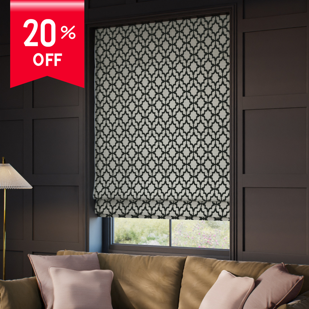 Patterned roller blind in a living room with a 20% off label.