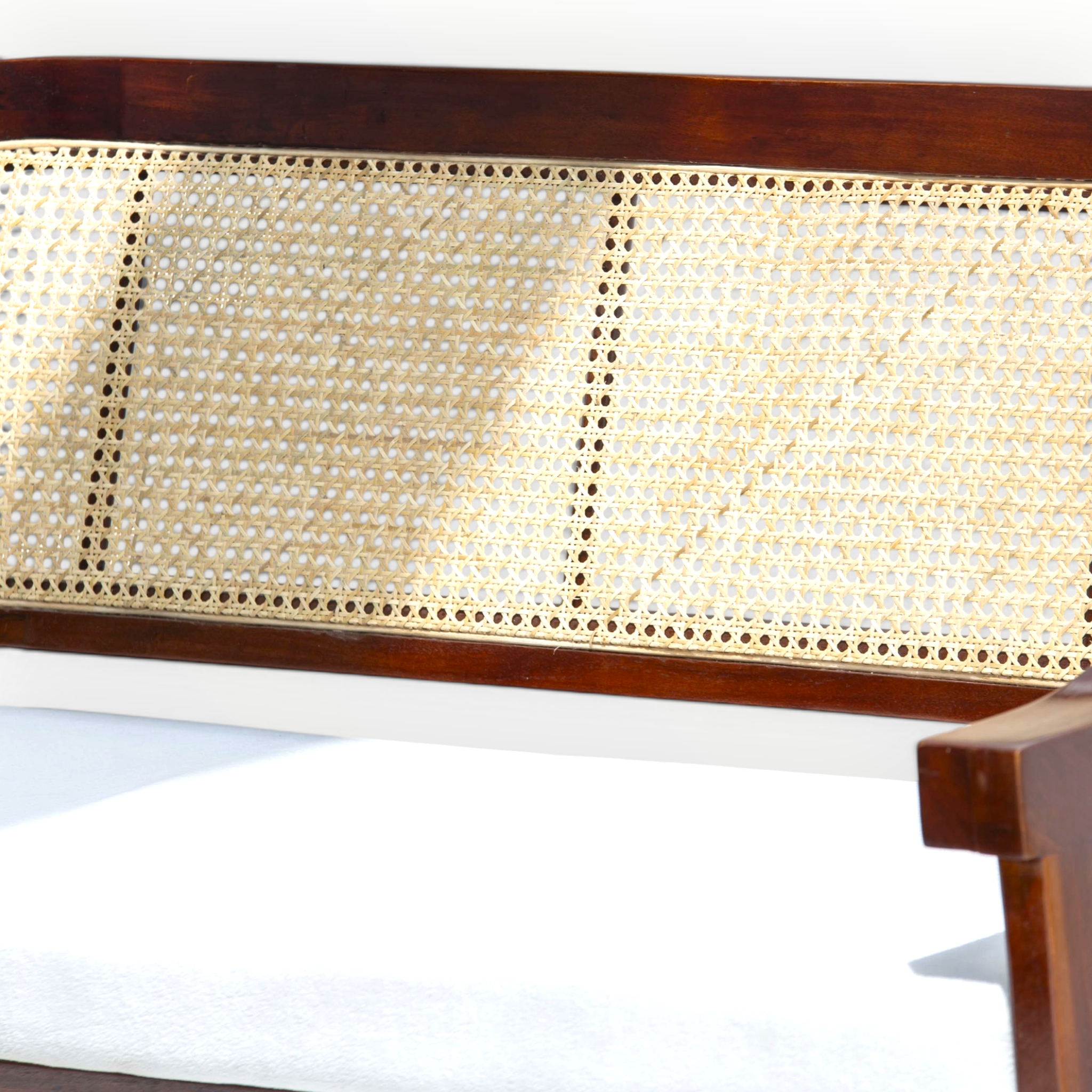 Wooden bench with wicker backrest on a white background