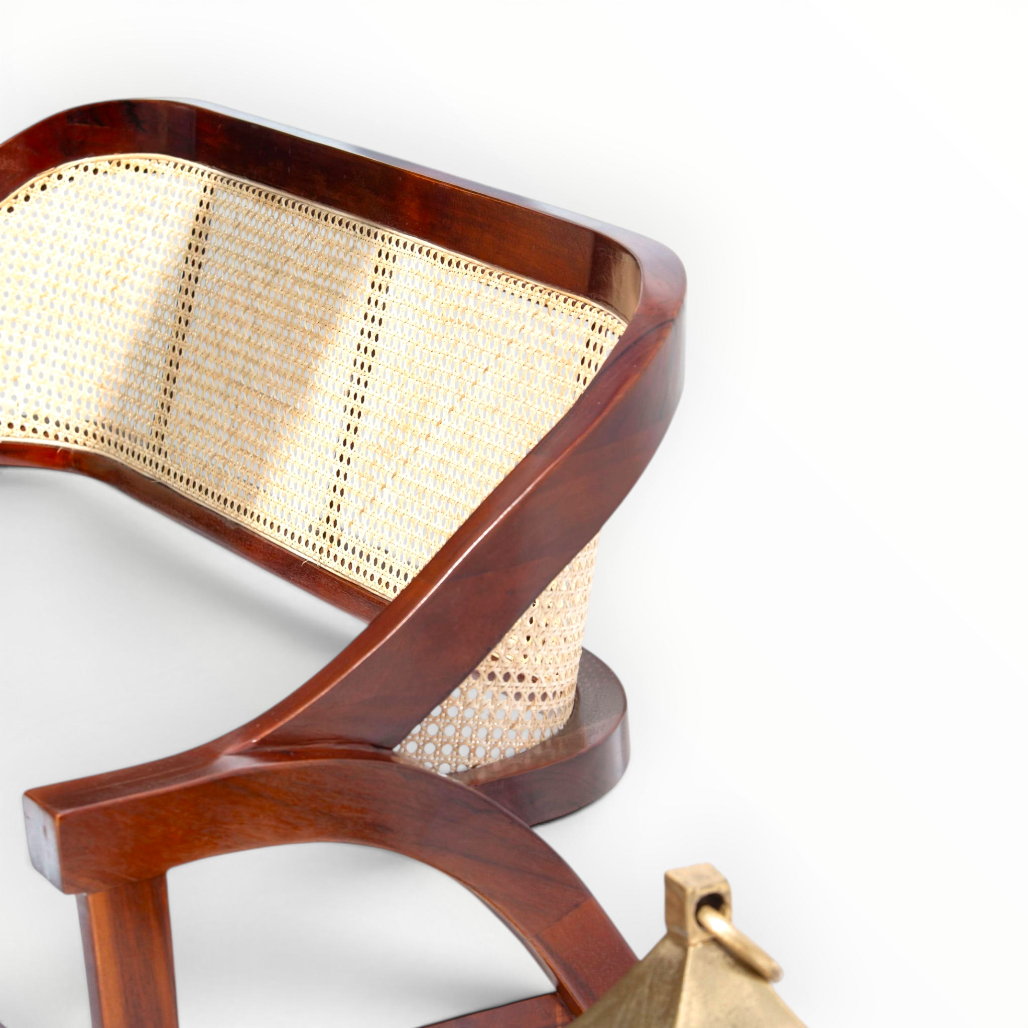 Wooden chair with wicker backrest on a white background