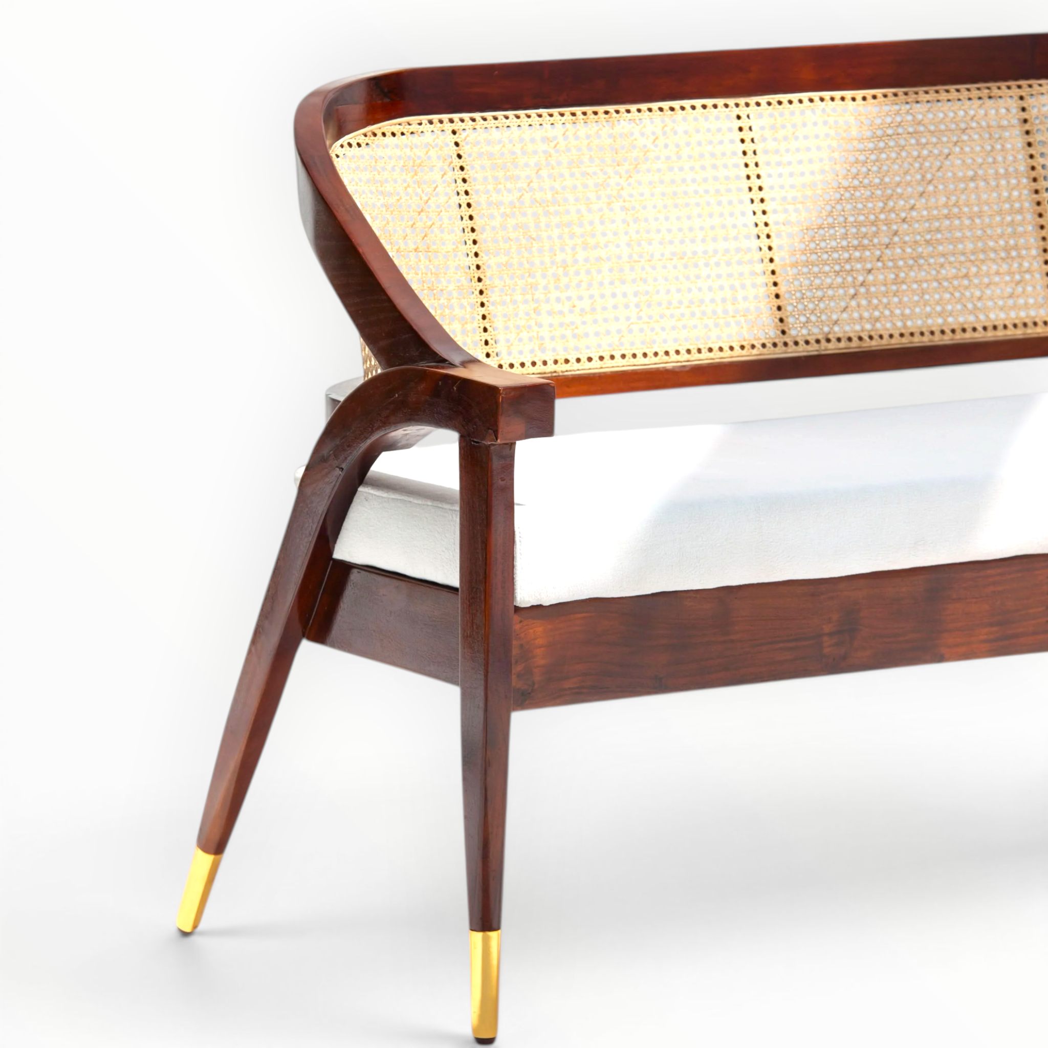 Wooden bench with wicker seat and gold legs on a white background
