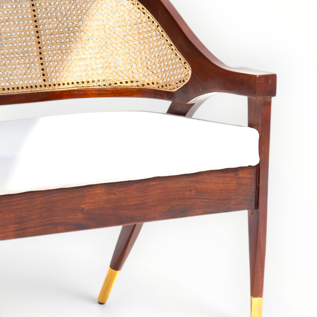Wooden chair with wicker backrest and white cushion on a white background