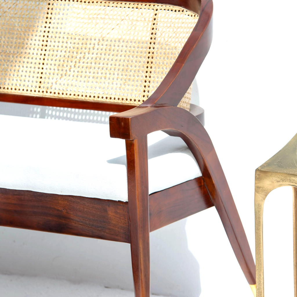 Wooden chair with wicker seat on a white background