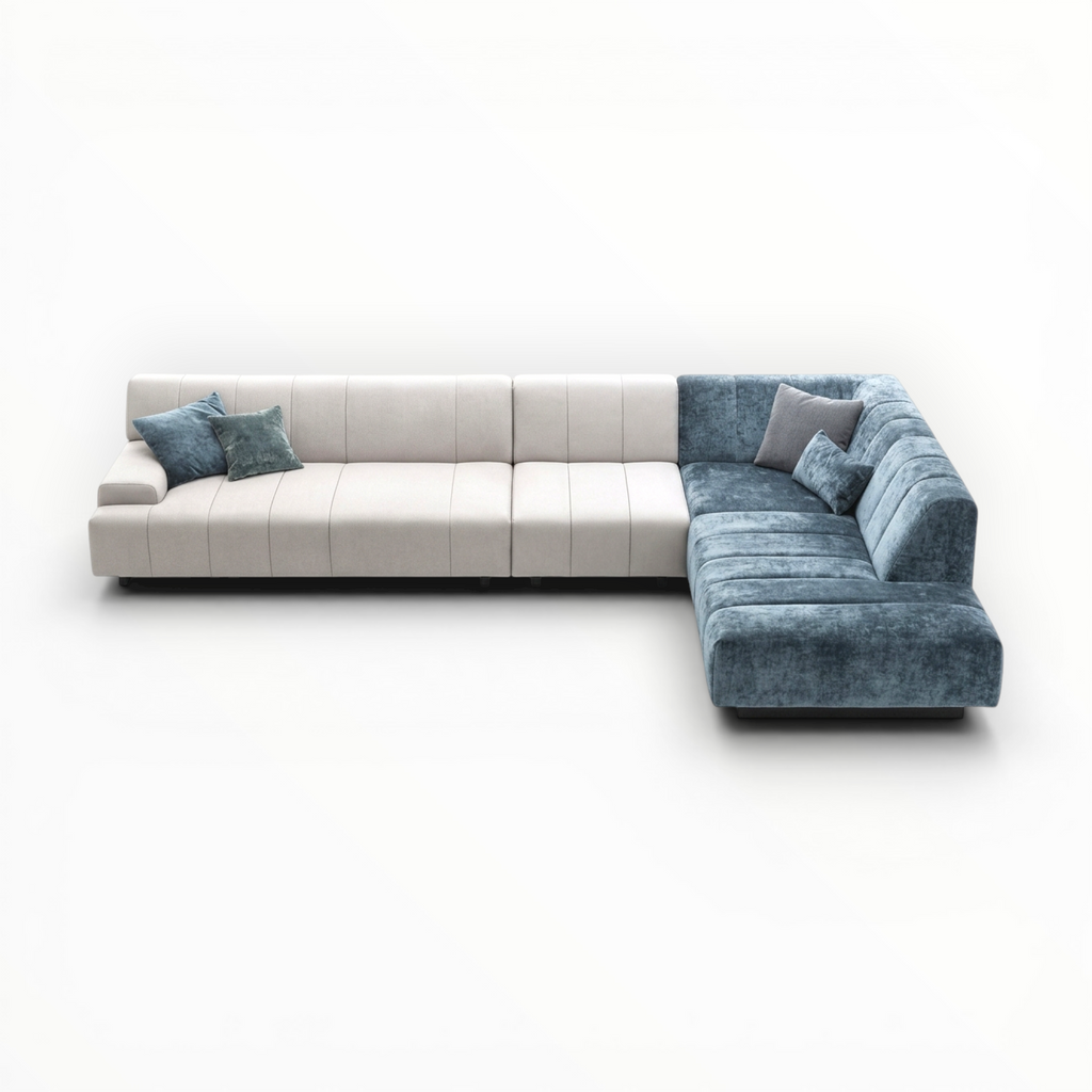 Modern sectional sofa with white and blue cushions on a white background