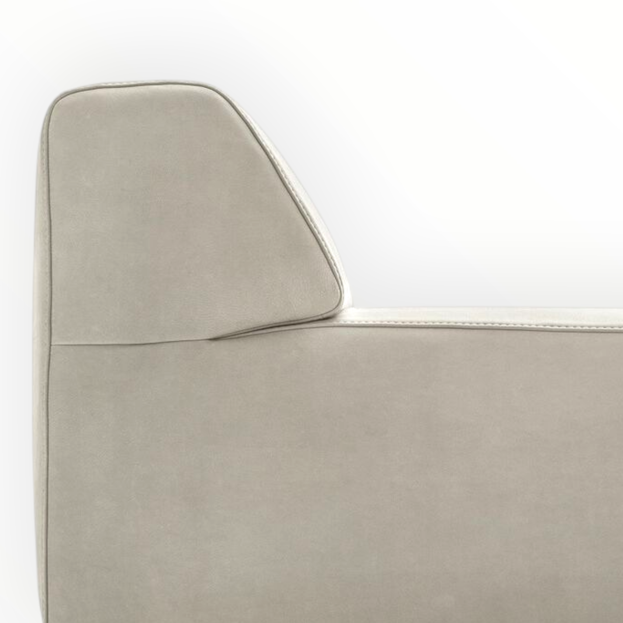 Close-up of a beige sofa with a white background