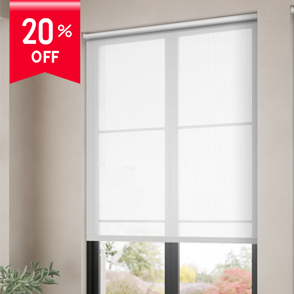 White roller blind with a 20% off label on a window with a view of plants.