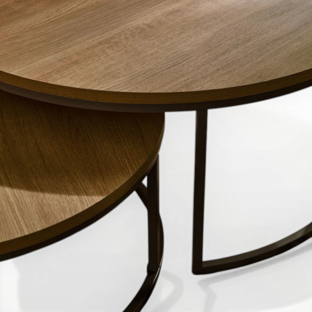 Wooden round table with metal legs on a white background