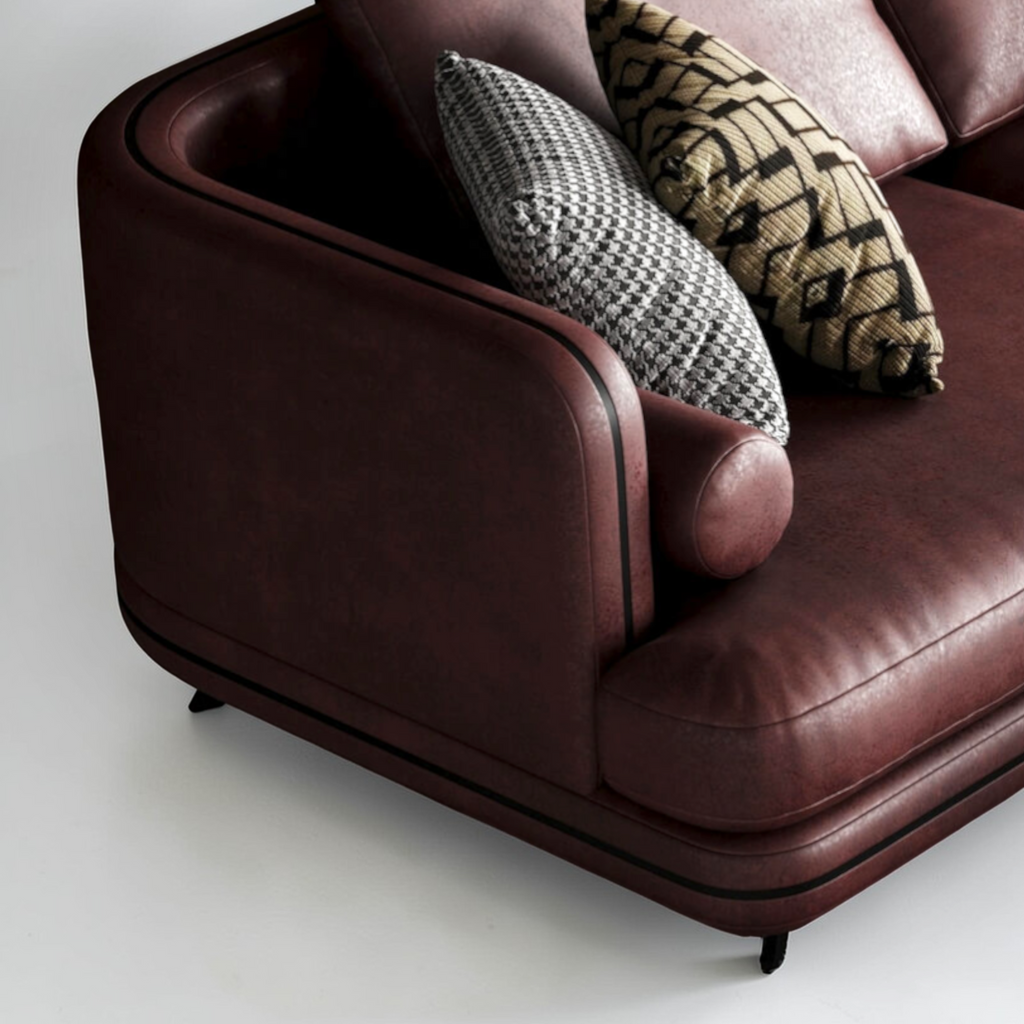 Brown leather armchair with patterned cushions on a white background