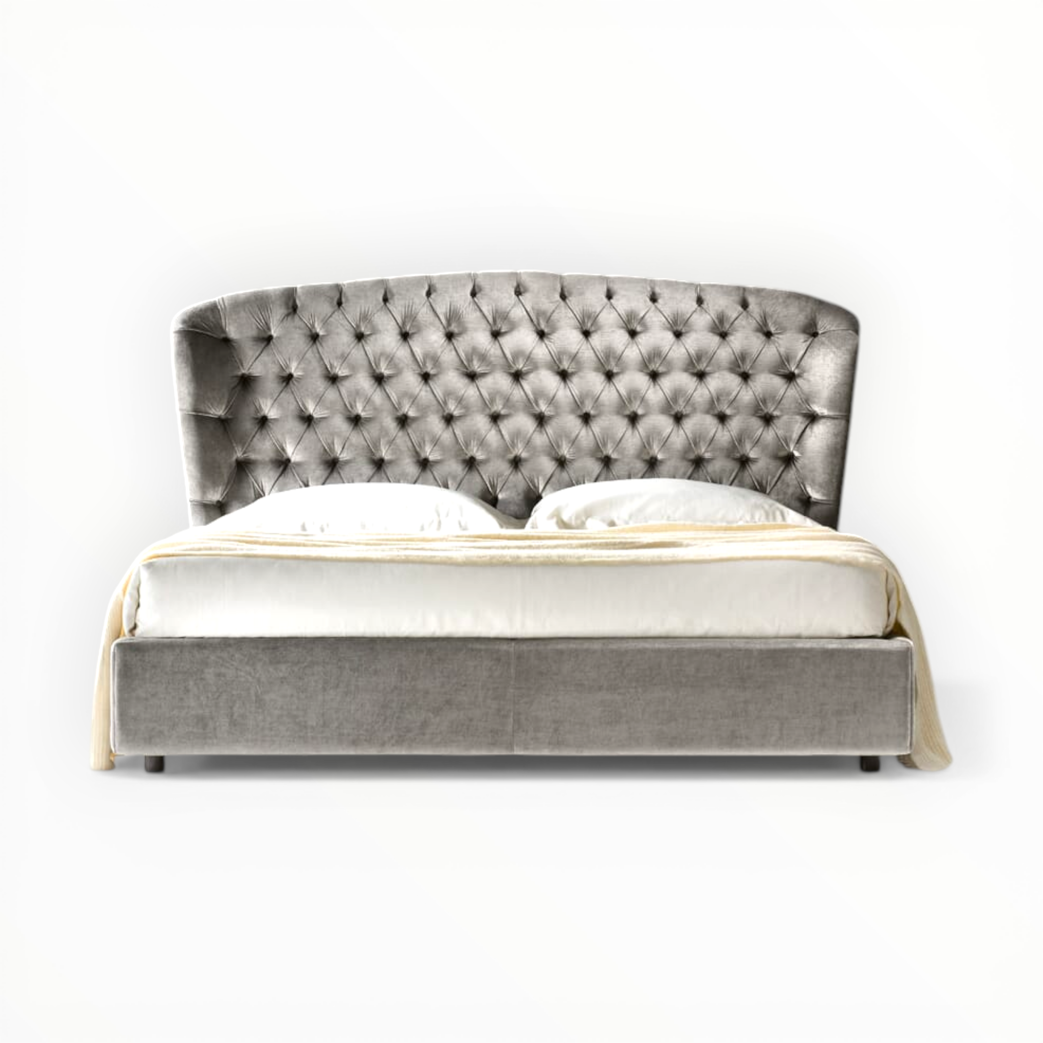 Gray tufted bed with white bedding on a white background