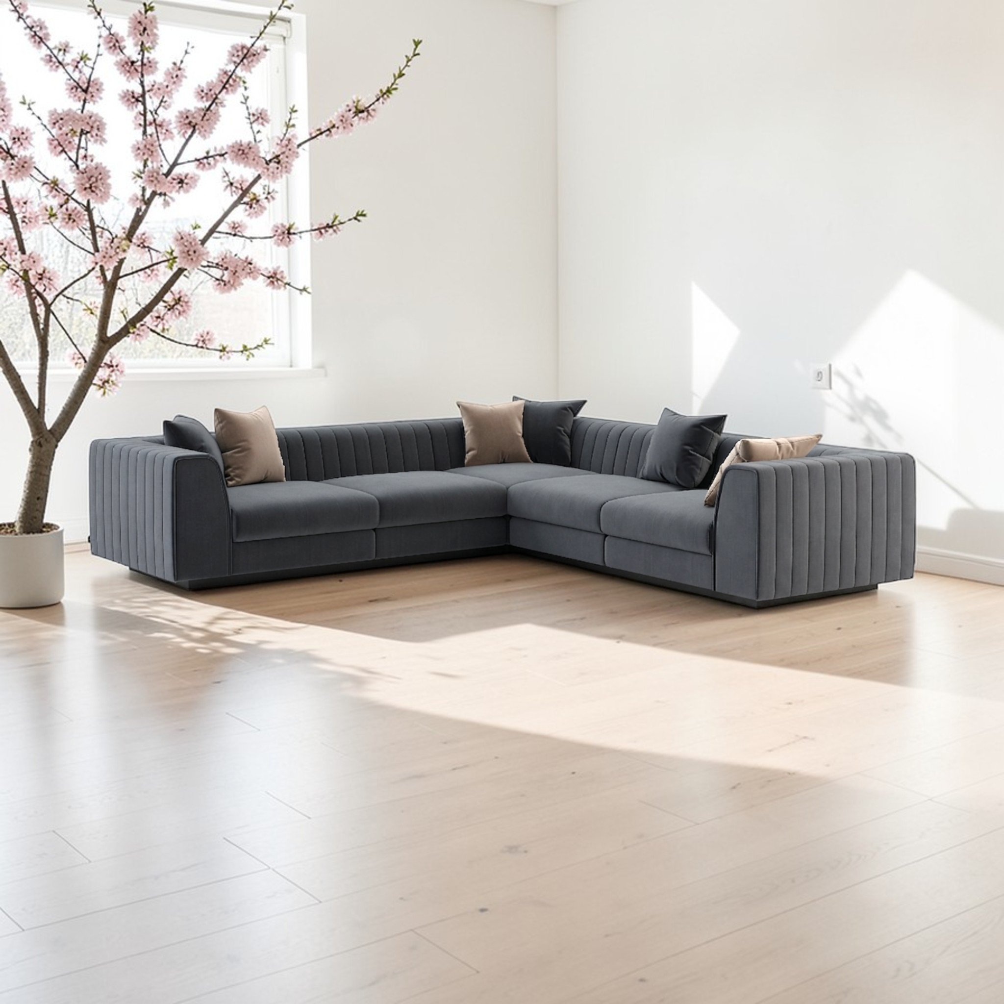 Gray sectional sofa in a modern living room with cherry blossom tree