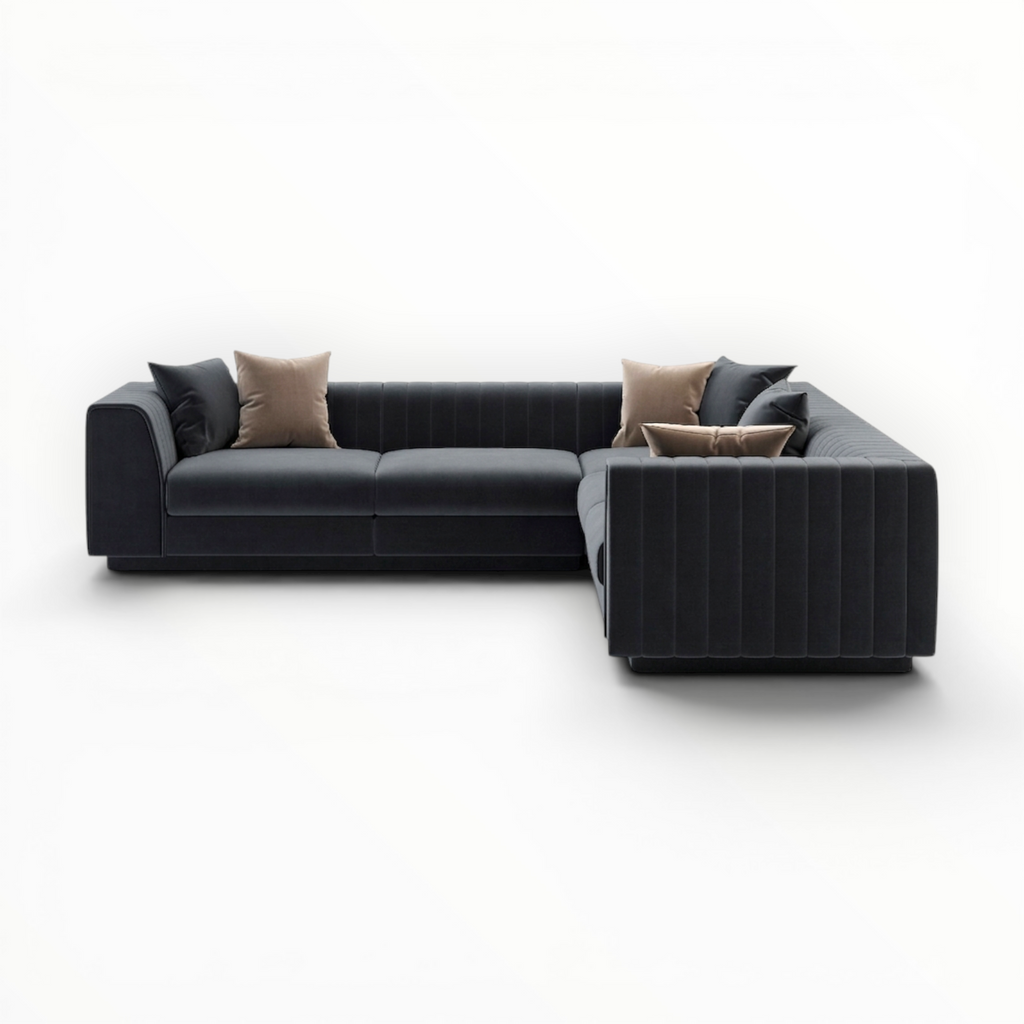 Modern black sectional sofa with cushions on a white background
