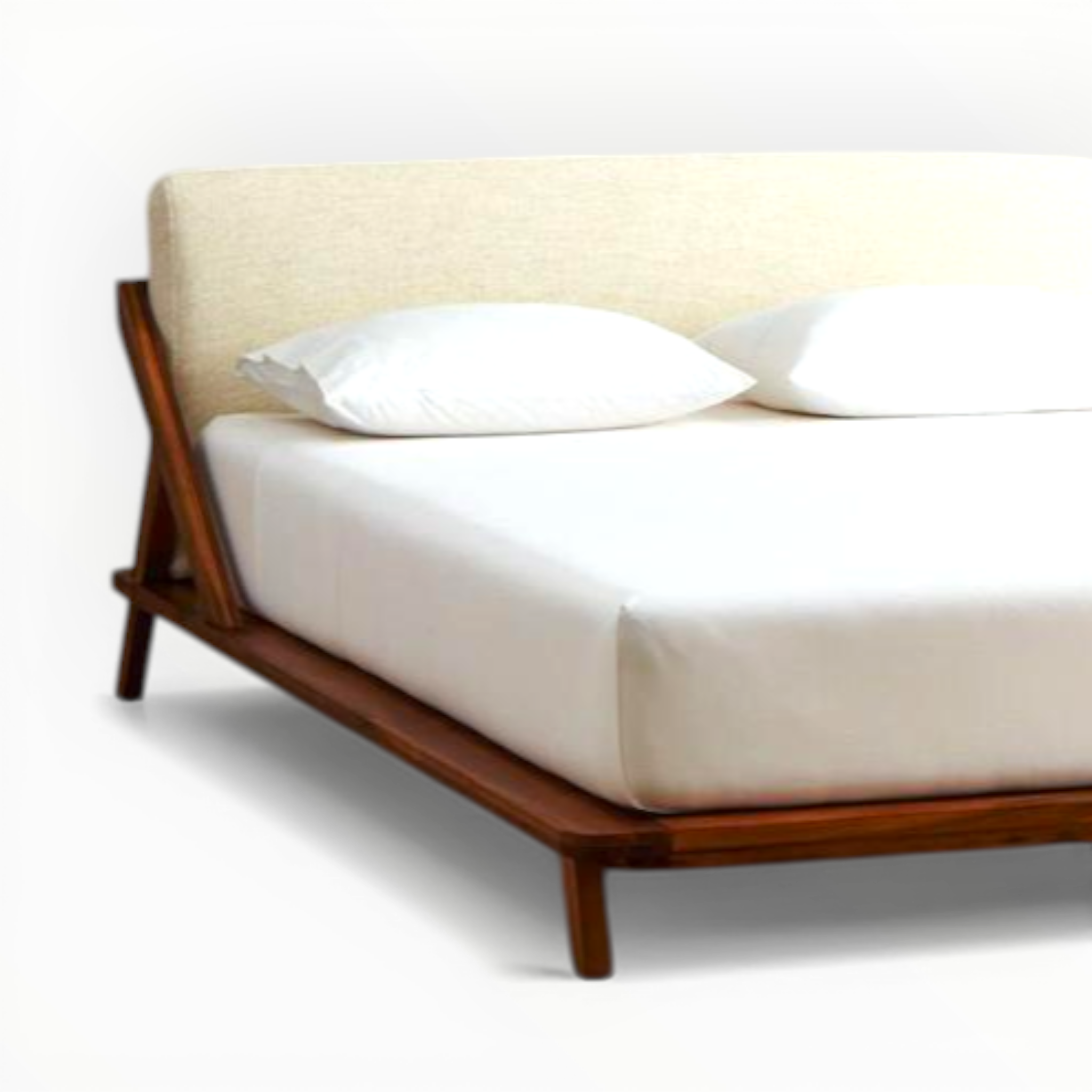 Bed with wooden frame and white bedding on a plain background