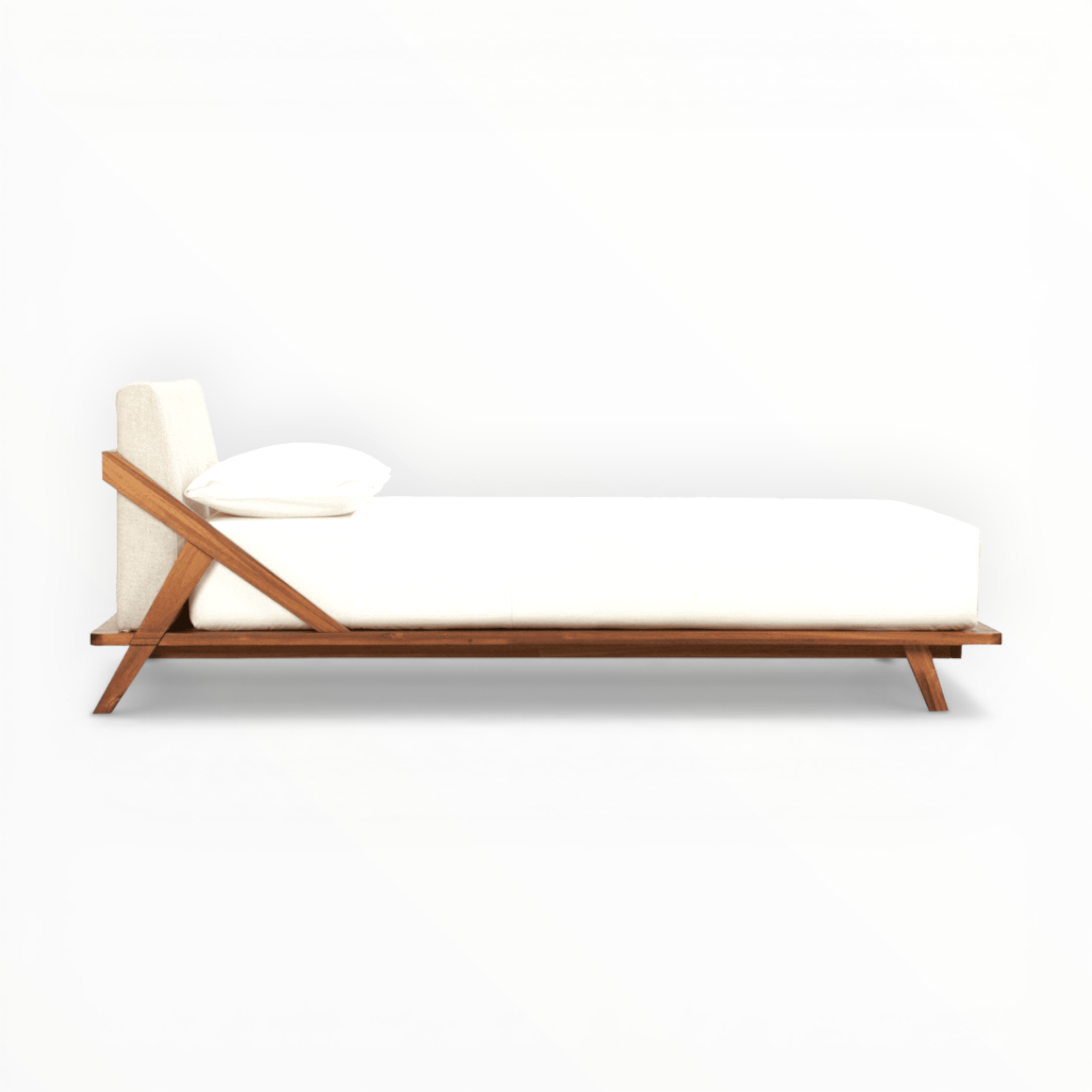 Modern bed with wooden frame and white mattress on a white background