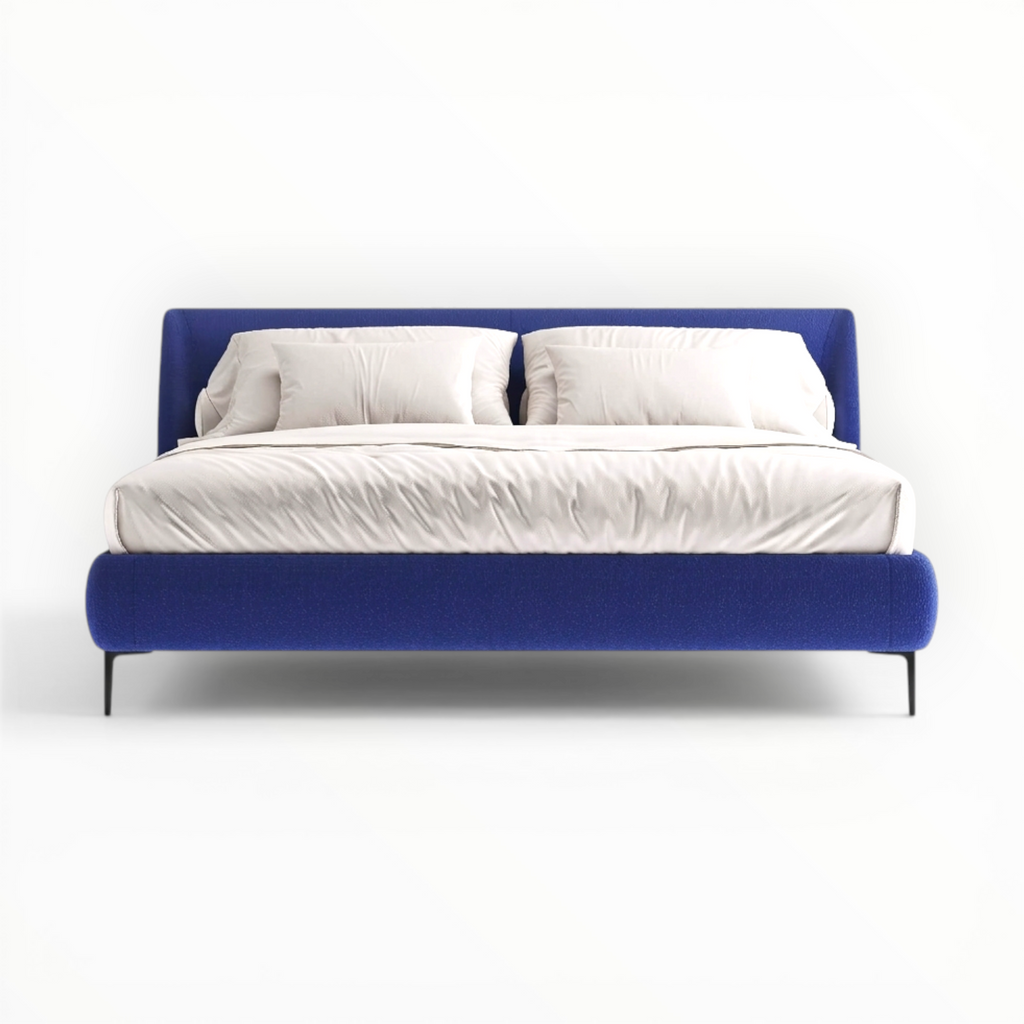 Modern bed with blue frame and white bedding on a white background