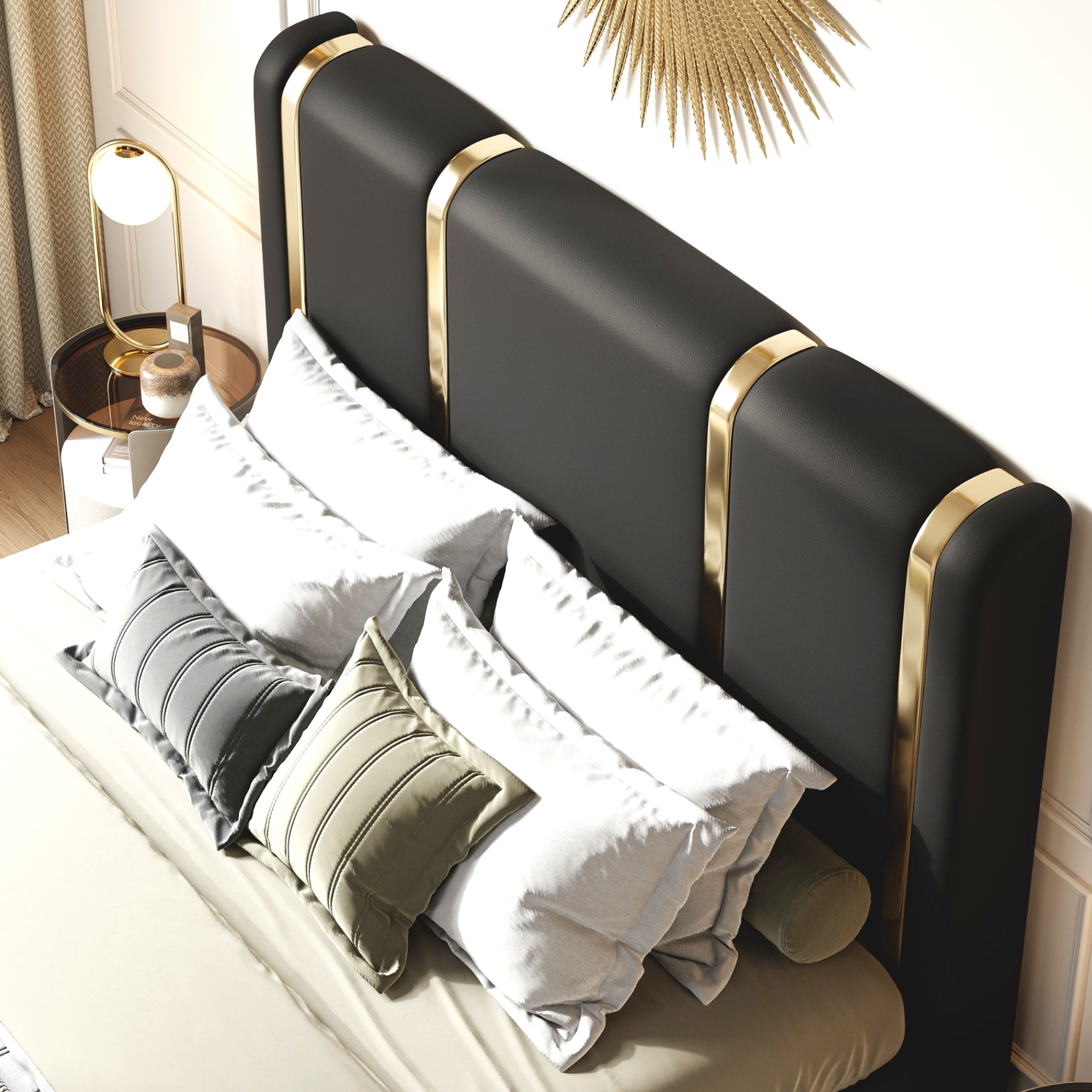 Black bed with gold accents and decorative pillows in a bedroom setting.