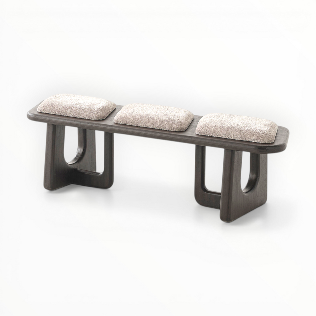 Modern bench with three cushioned seats on a white background