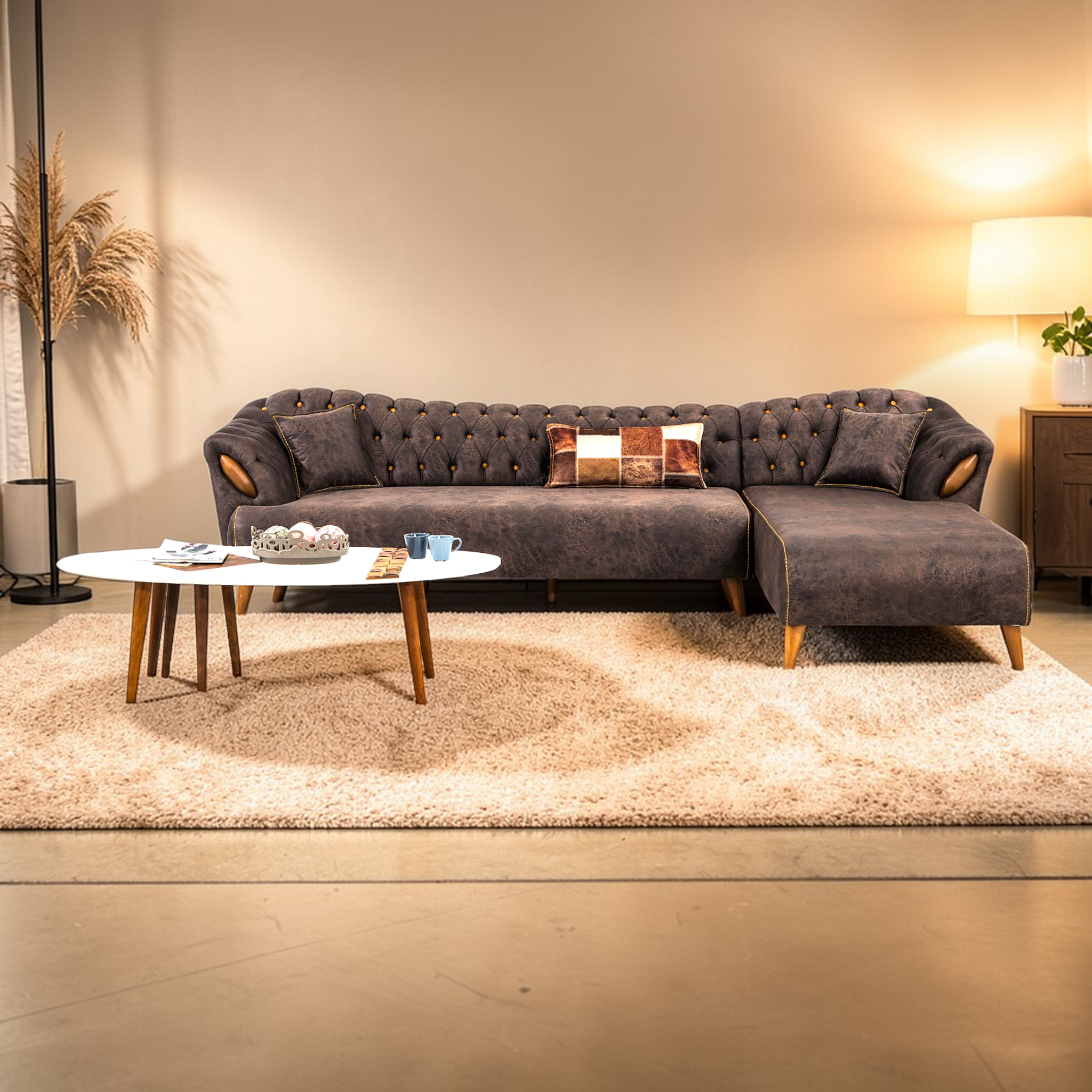 Gray sectional sofa in a living room setting with a coffee table and decorative items.