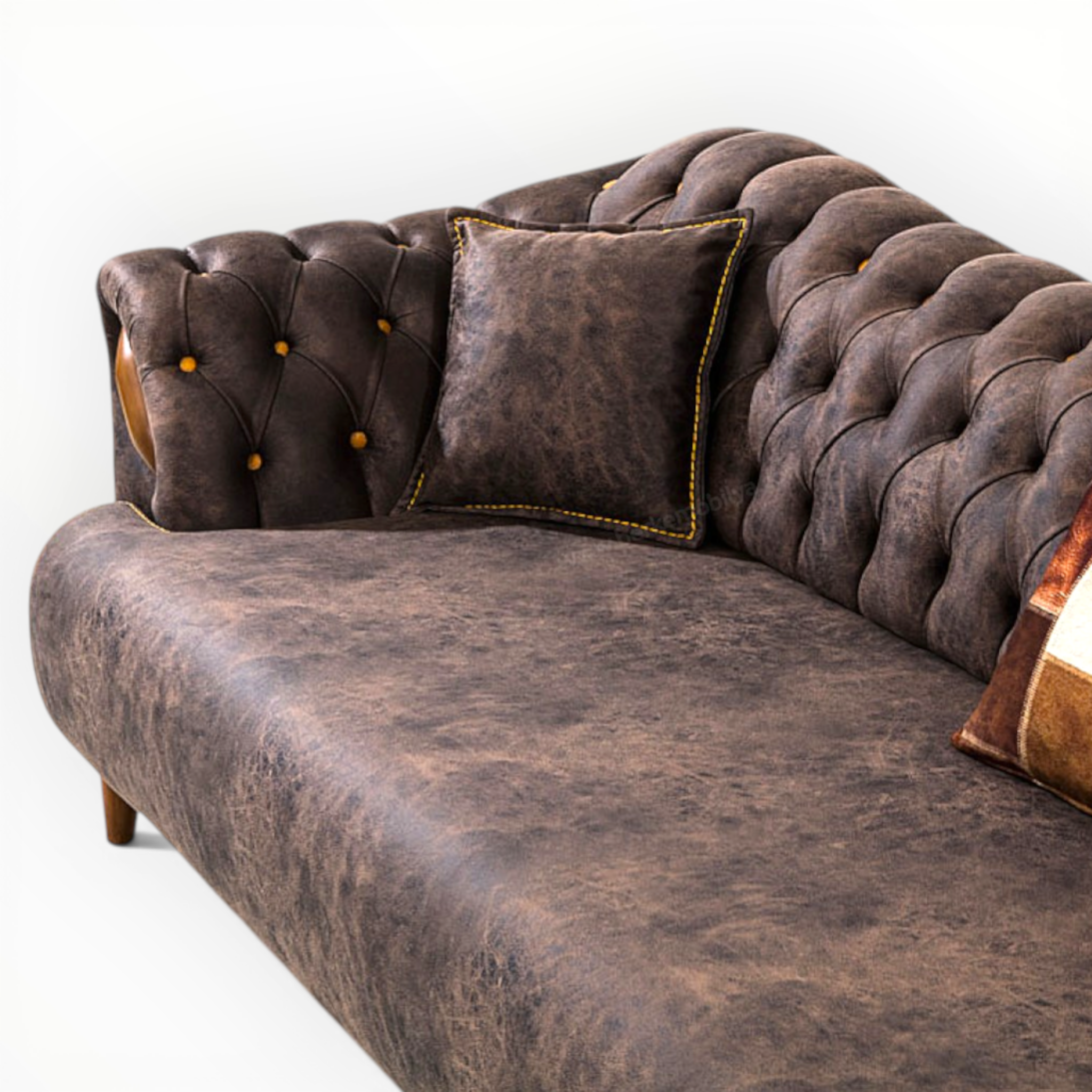 Brown leather sofa with tufted backrest and decorative pillows on a white background