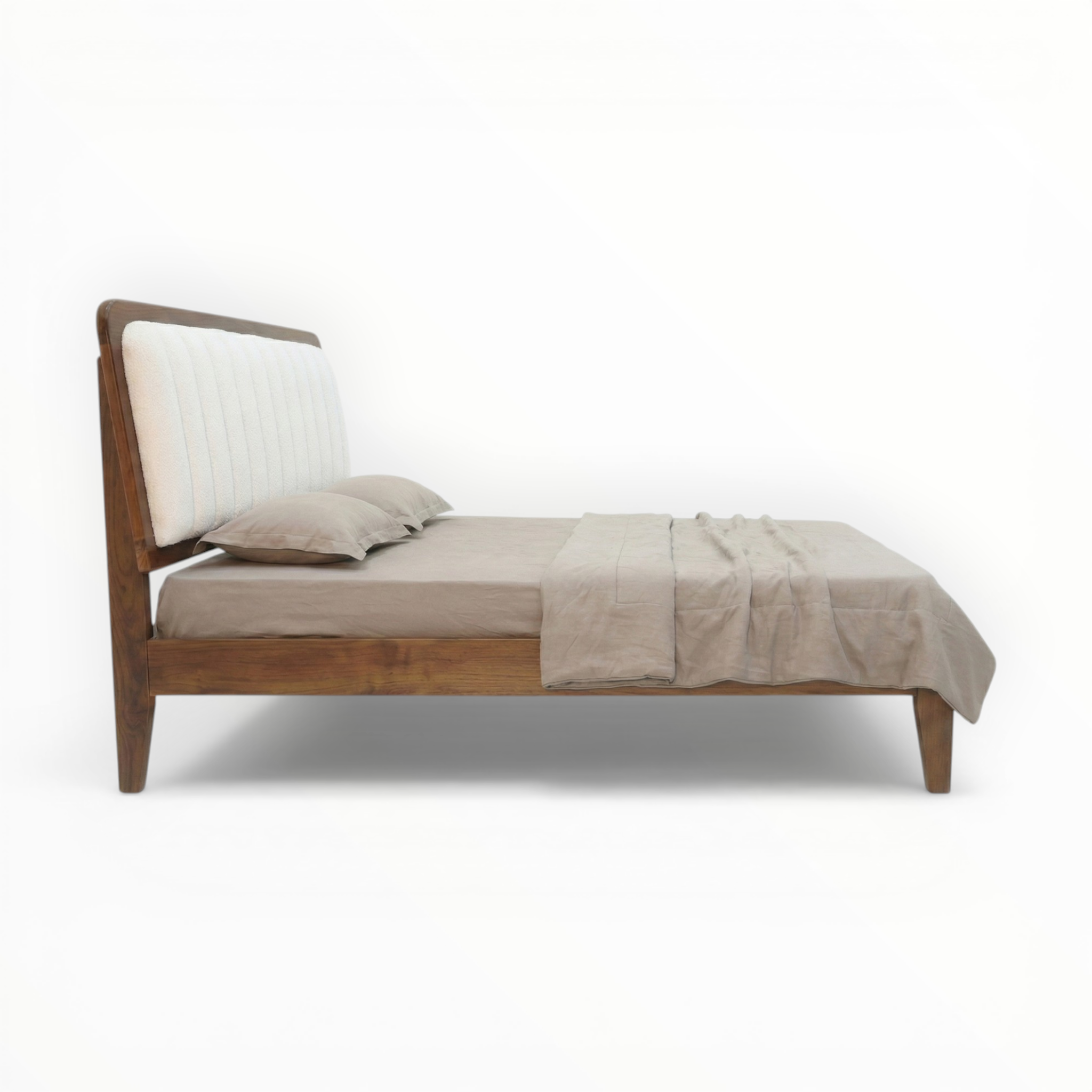Wooden bed with beige bedding on a white background