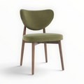 Emerald dining chair close-up – curved floating backrest with olive green velvet upholstery